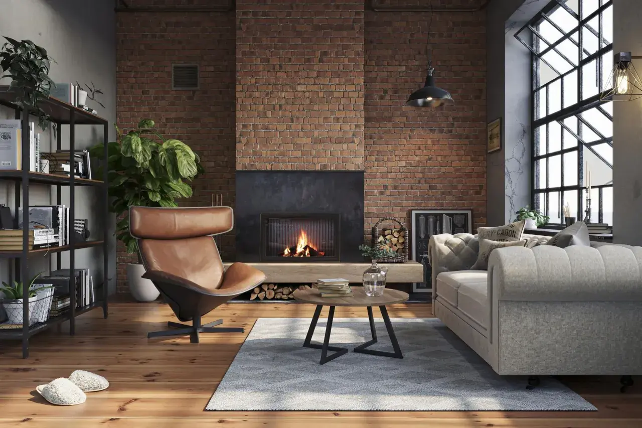 Przytulny salon w stylu soft loft z ceglaną ścianą, kominkiem, wygodnym fotelem i sofą.