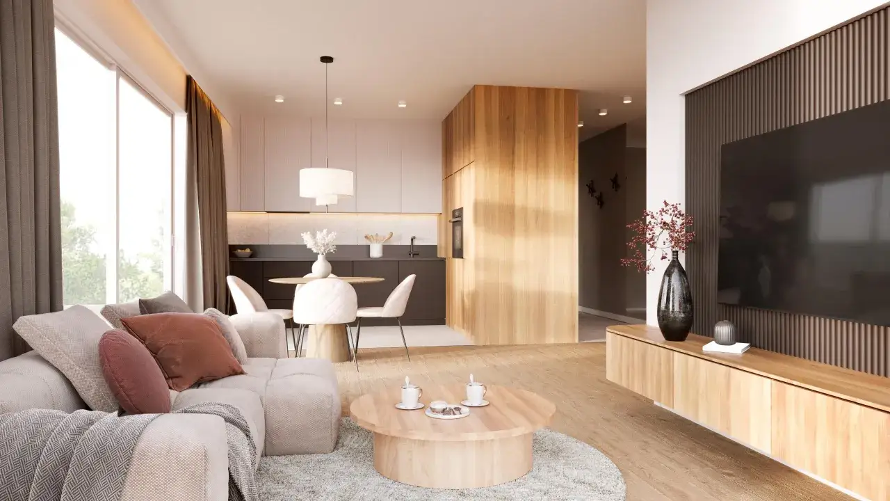 Przytulny salon z sofą i stolikiem kawowym w stylu japandi. W tle kuchnia z jadalnią, wszystko w stonowanych barwach i naturalnych materiałach.